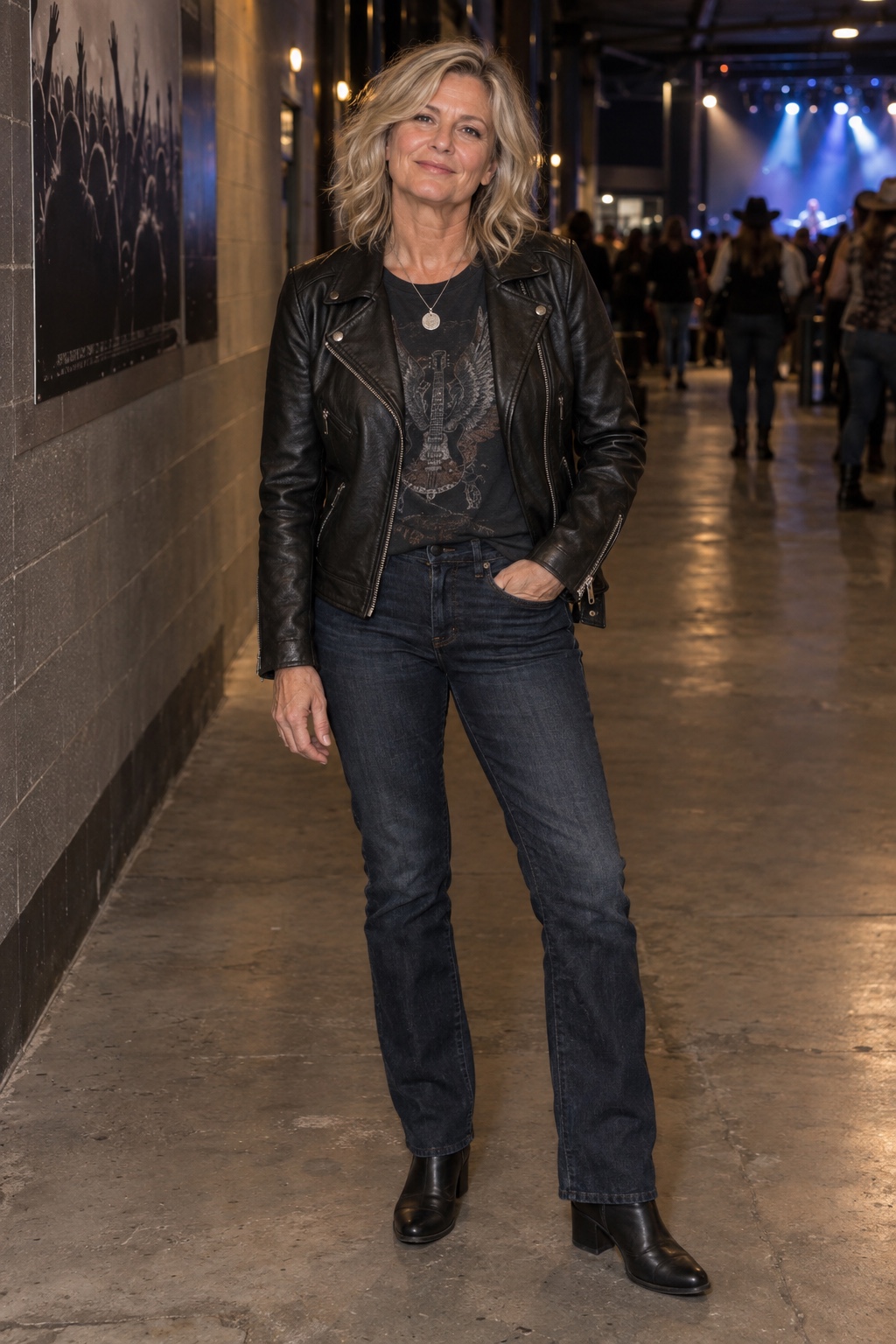 Leather jacket, dark denim, black boots — worn by a woman in her fifties
