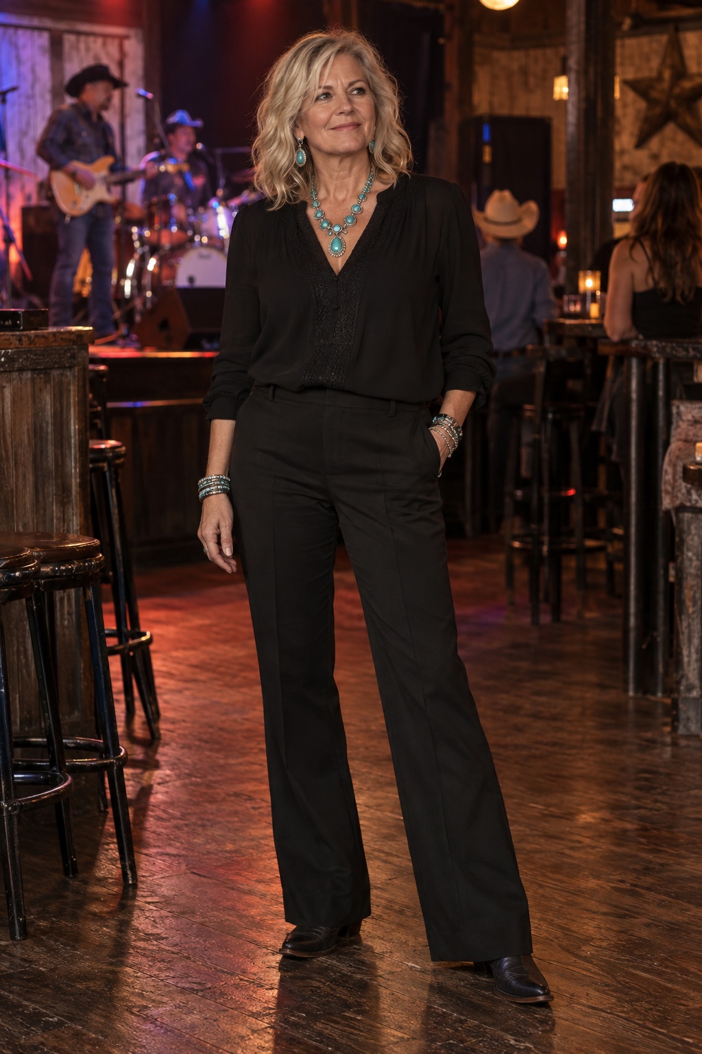 All black, with turquoise and silver — worn by a woman in her fifties