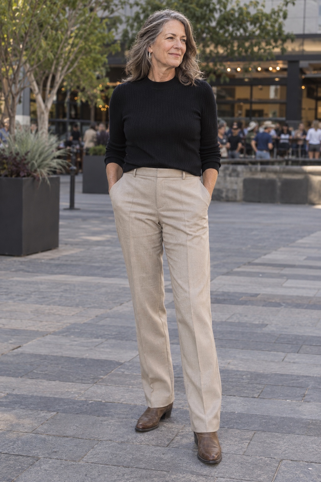 Tailored trousers with a western boot — worn by a woman in her fifties