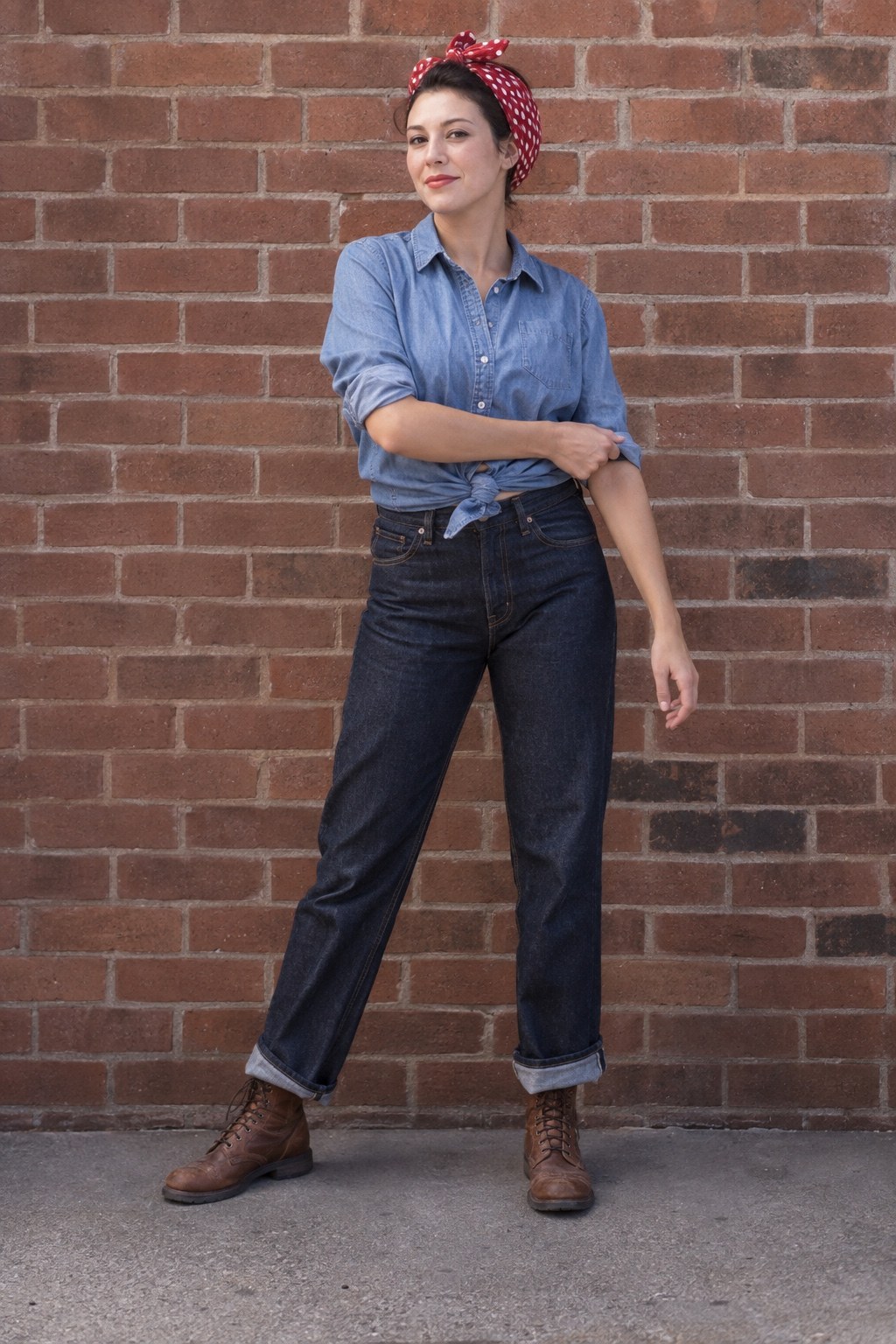 Vintage factory-worker-inspired Halloween outfit with dark jeans, chambray shirt, boots and red hair scarf.